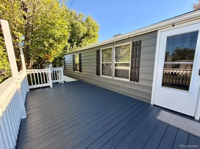 a view of a backyard with large trees