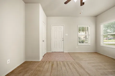 a view of an empty room with a window