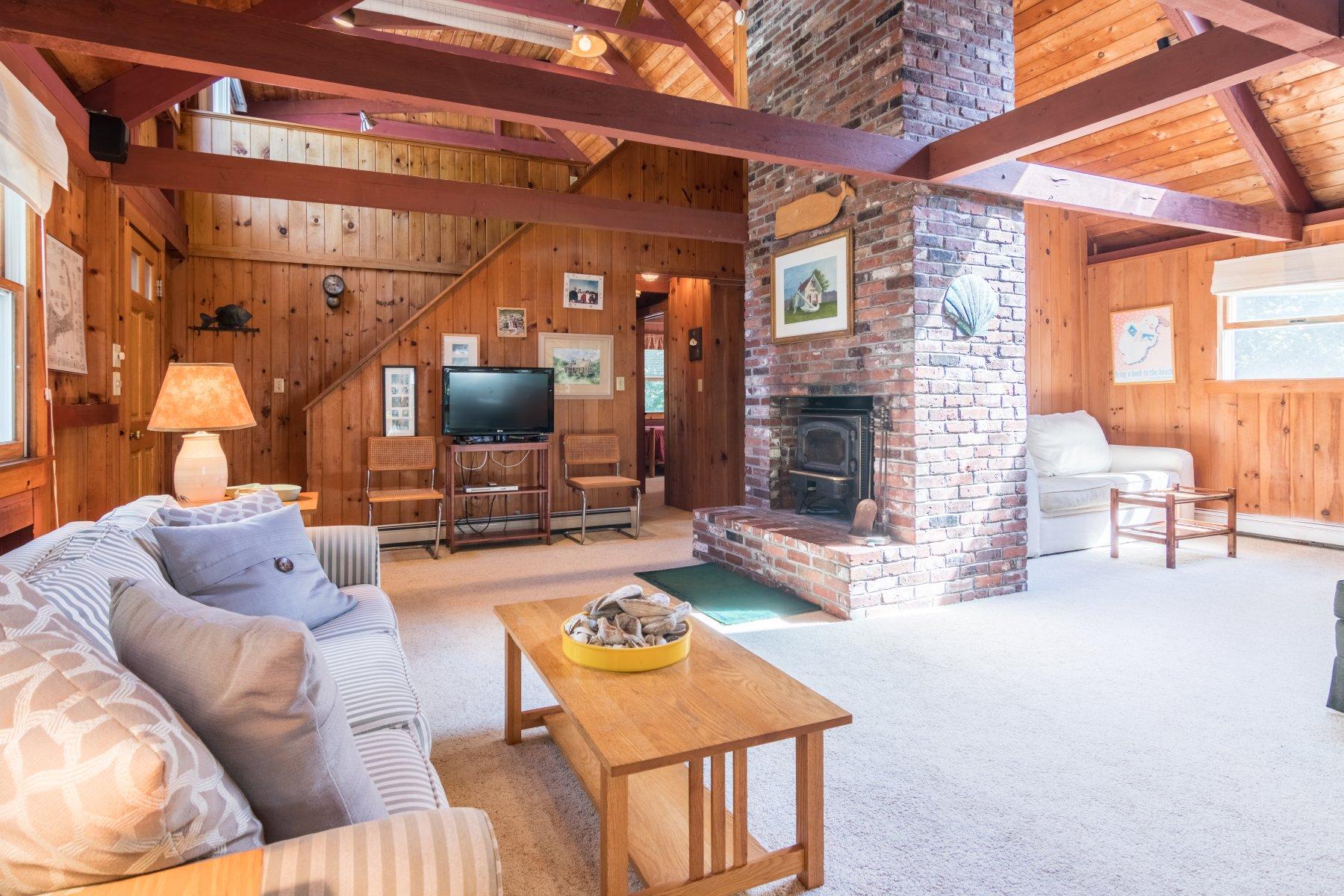 115 Cole Road Eastham, MA 02642 - Photo 12 of 33 a living room with furniture and a flat screen tv