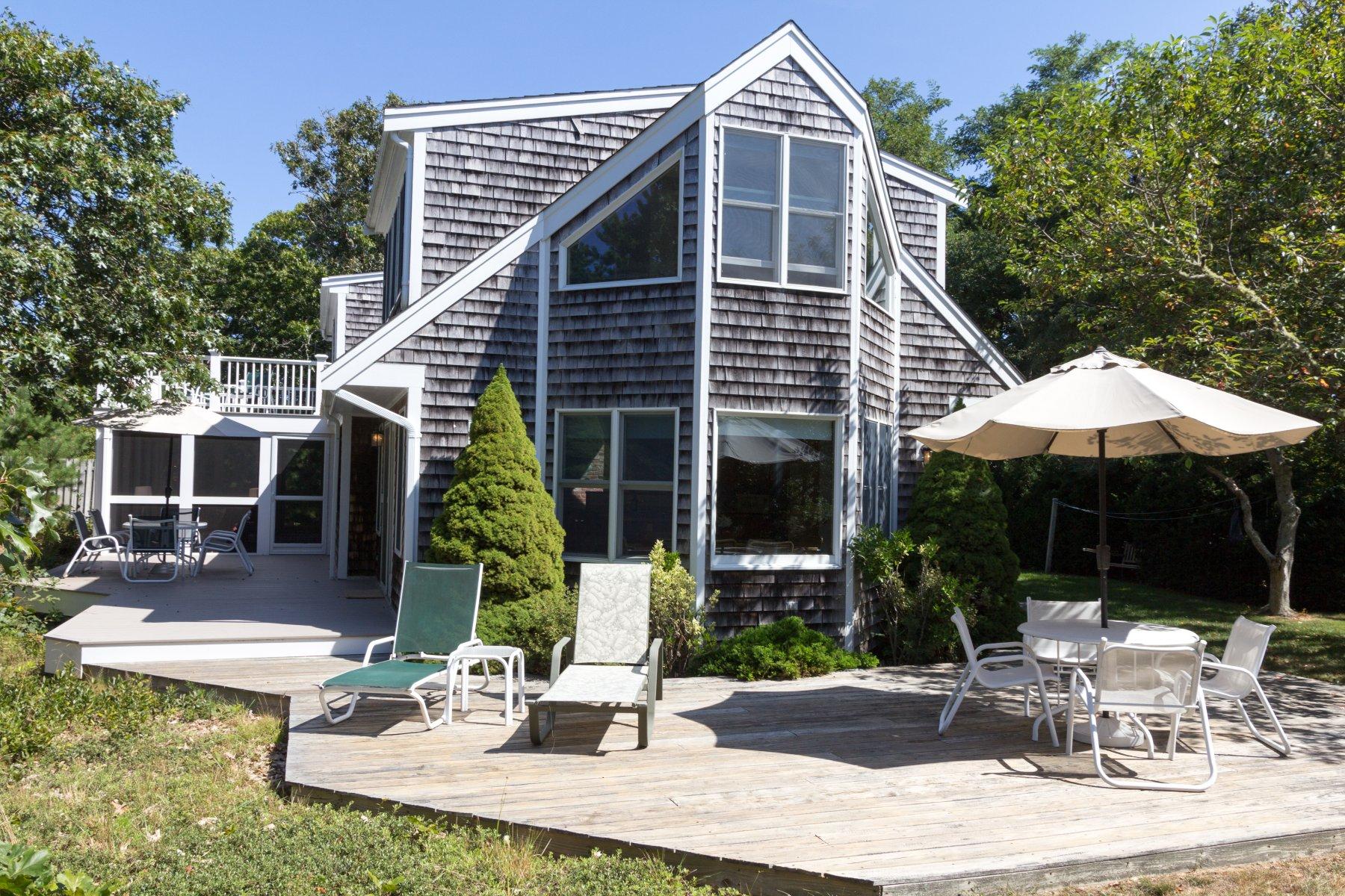 115 Cole Road Eastham, MA 02642 - Photo 32 of 33 a front view of house with yard and outdoor seating