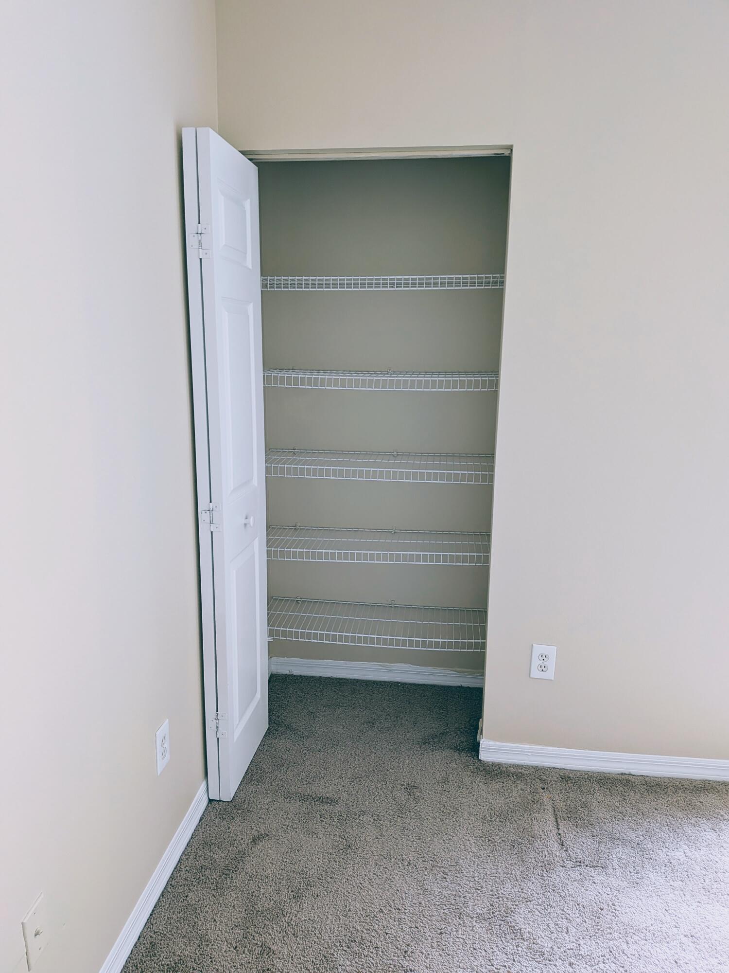 10348 Fox Trail Road South, Unit 513 Royal Palm Beach, FL 33411 - Photo 9 of 13 2ND BEDROOM LINEN CLOSET - Copy