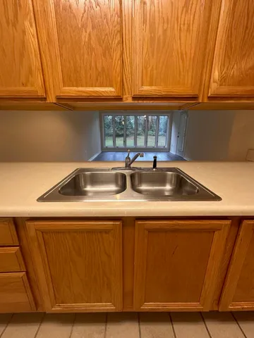a kitchen with a sink and cabinets
