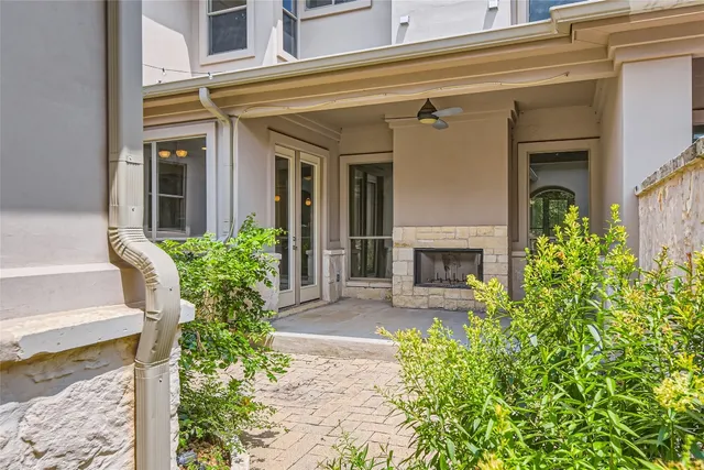 a front view of a house with plants