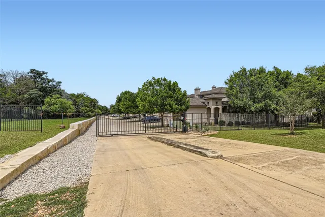 a view of a swimming pool with a yard