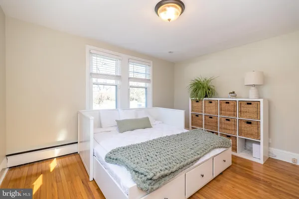 a living room with a rug and a couch