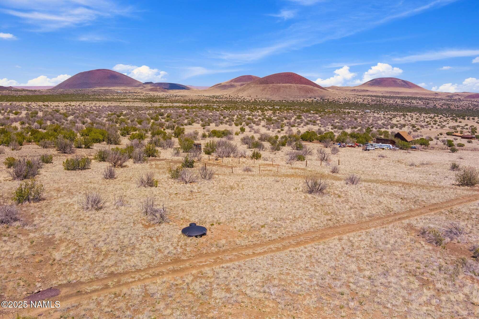 0 Leupp Road Flagstaff, AZ 86004 - Photo 15 of 17 a view of a house with a mountain in the background