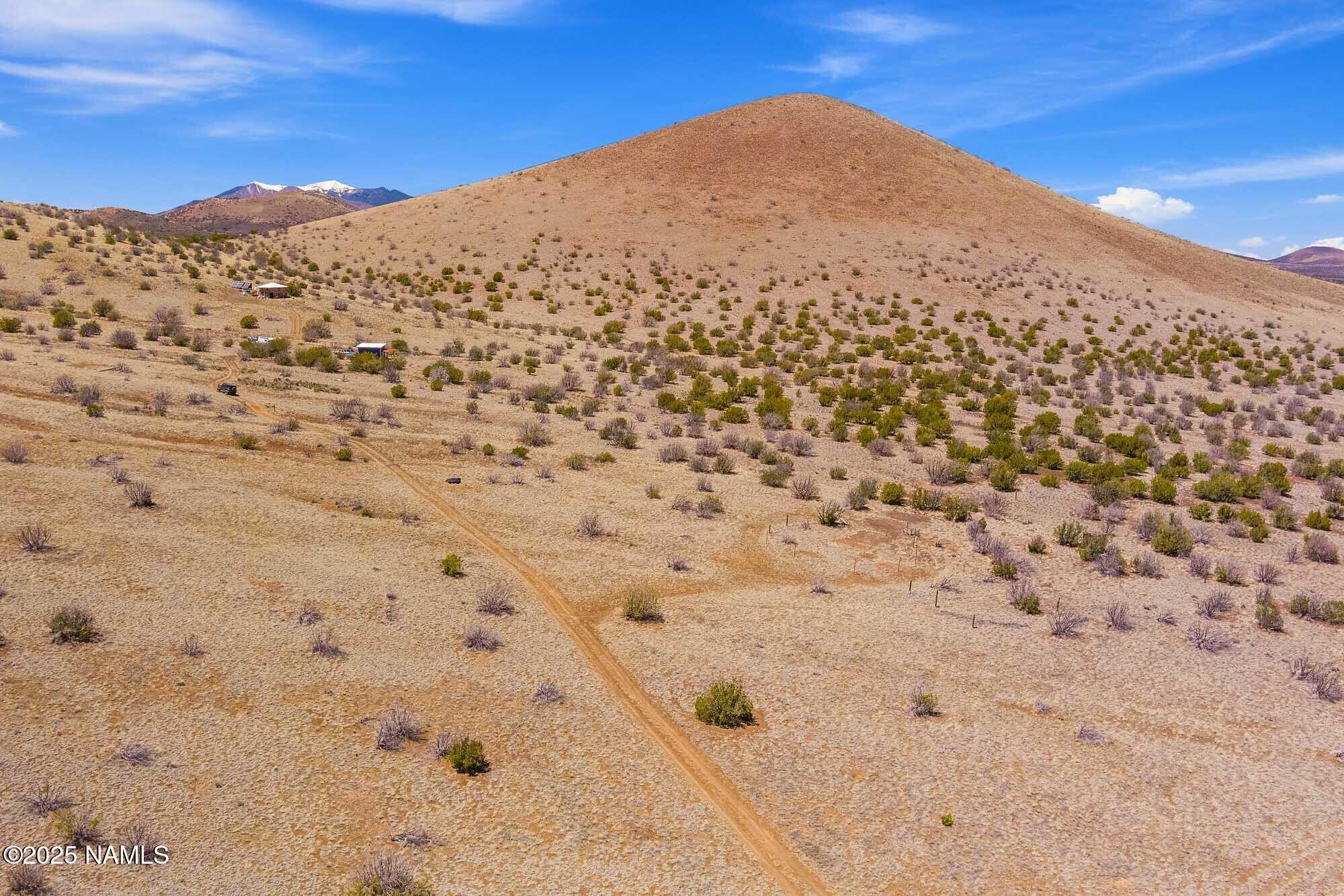 0 Leupp Road Flagstaff, AZ 86004 - Photo 2 of 17 a view of a dry yard with mountains in the background