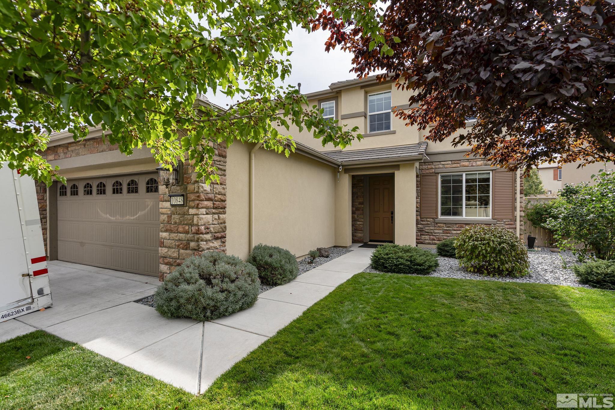 10848 Walnut Ridge Drive Reno, NV 89521 - Photo 1 of 32 a front view of house with yard and green space
