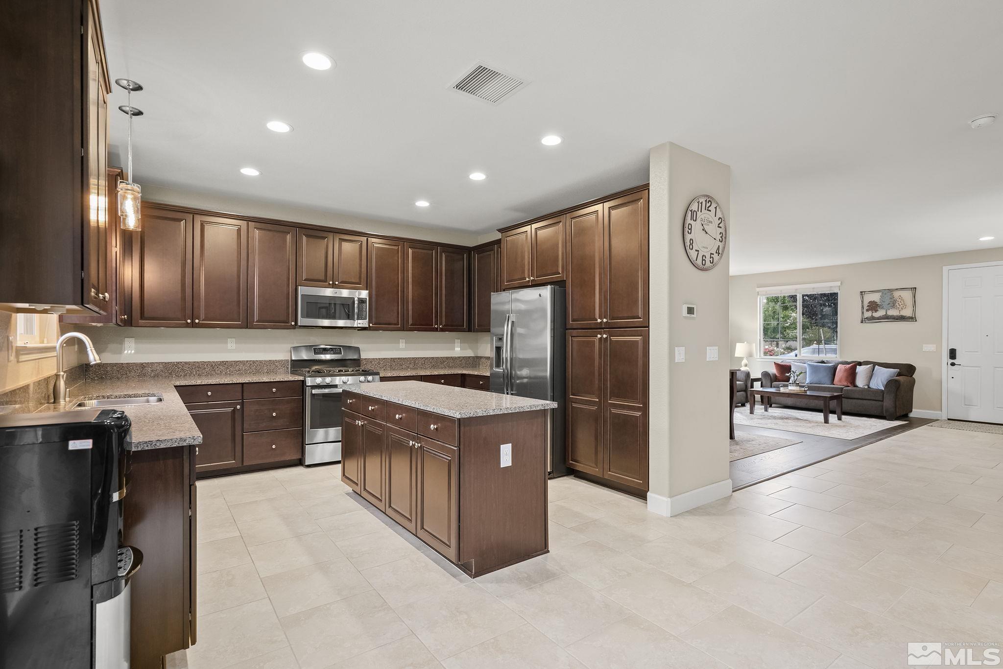 10848 Walnut Ridge Drive Reno, NV 89521 - Photo 11 of 32 a kitchen with refrigerator and cabinets