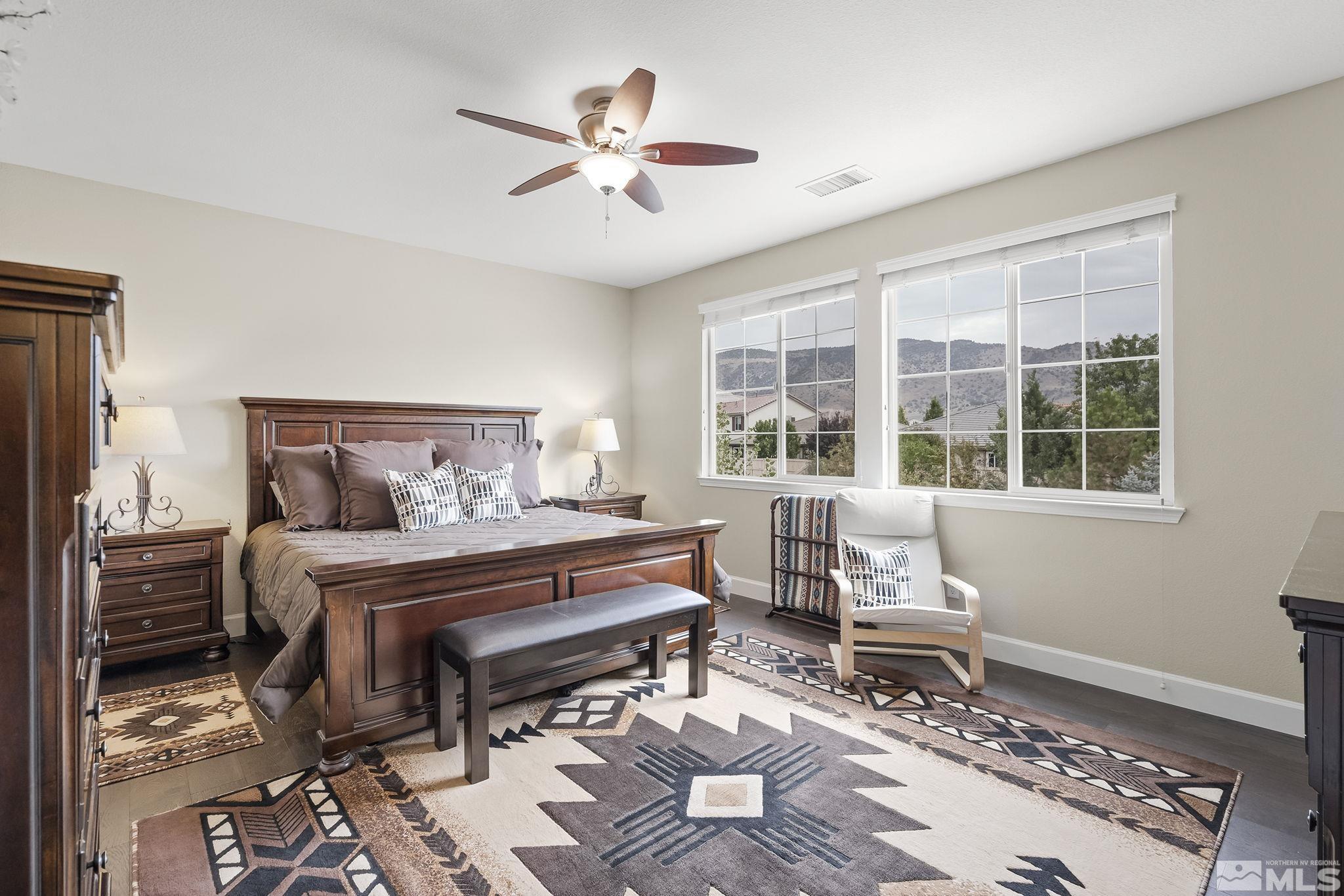 10848 Walnut Ridge Drive Reno, NV 89521 - Photo 14 of 32 a bedroom with a bed and wooden floor