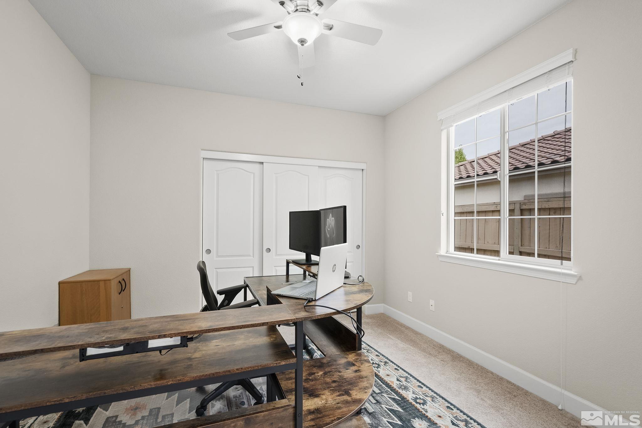 10848 Walnut Ridge Drive Reno, NV 89521 - Photo 18 of 32 a view of a workspace with a window