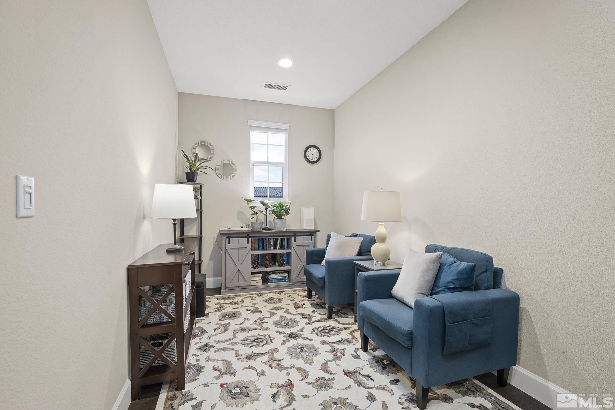 10848 Walnut Ridge Drive Reno, NV 89521 - Photo 21 of 32 a living room with furniture and wooden floor