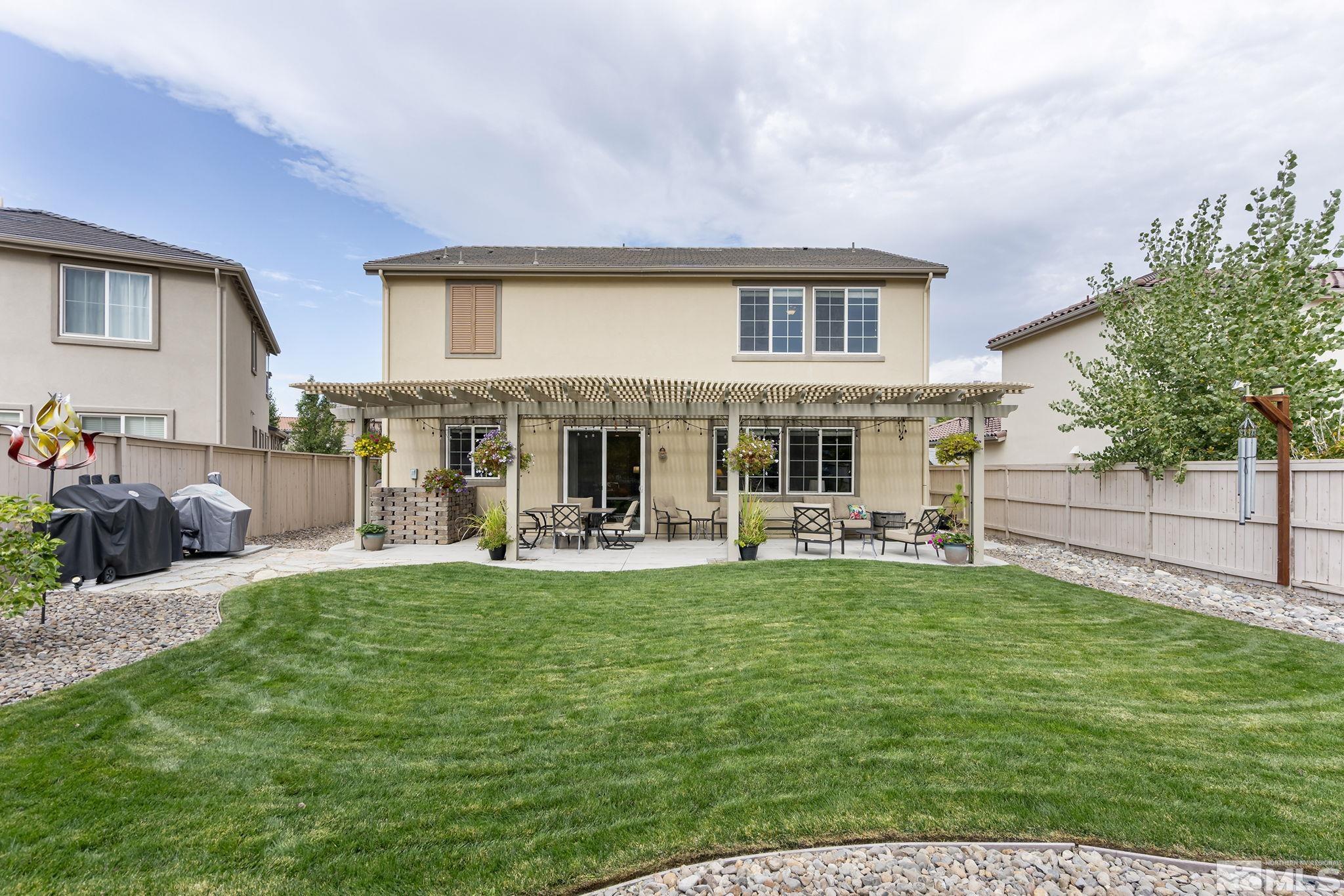 10848 Walnut Ridge Drive Reno, NV 89521 - Photo 27 of 32 a view of a house with a yard and sitting area