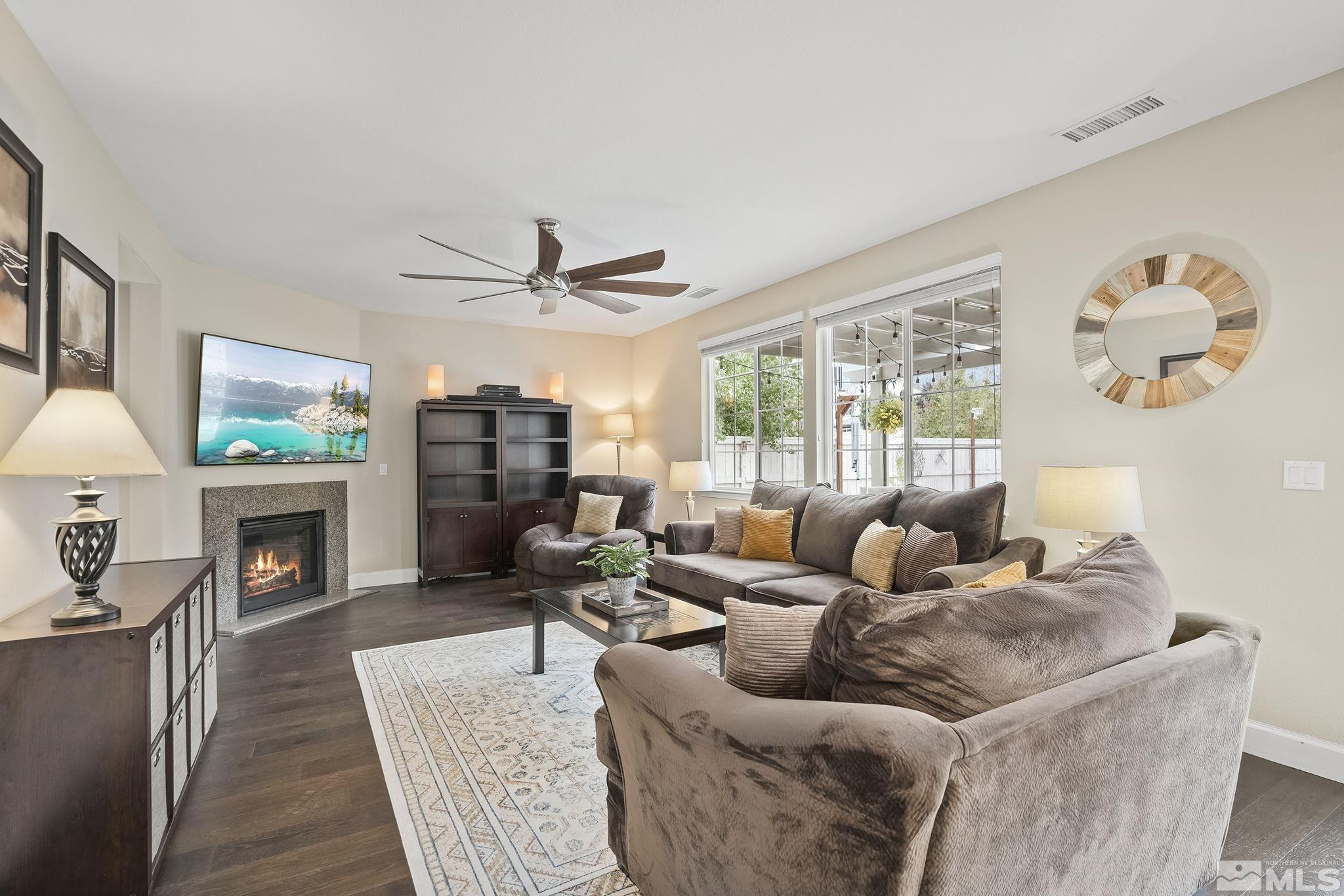 10848 Walnut Ridge Drive Reno, NV 89521 - Photo 7 of 32 a living room with furniture and a fireplace