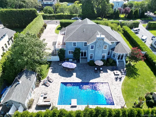 a aerial view of a house with table and chairs