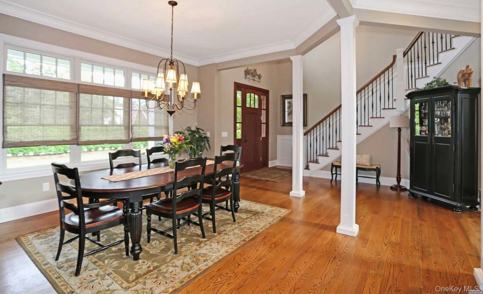 43 Shore Road Remsenburg, NY 11960 - Photo 11 of 28 a view of a dining room with furniture window and wooden floor