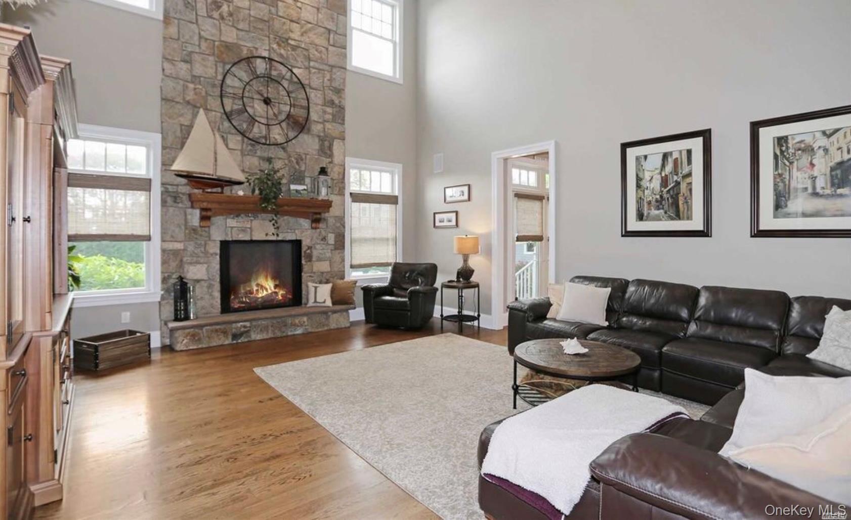 43 Shore Road Remsenburg, NY 11960 - Photo 16 of 28 a living room with furniture and a fireplace