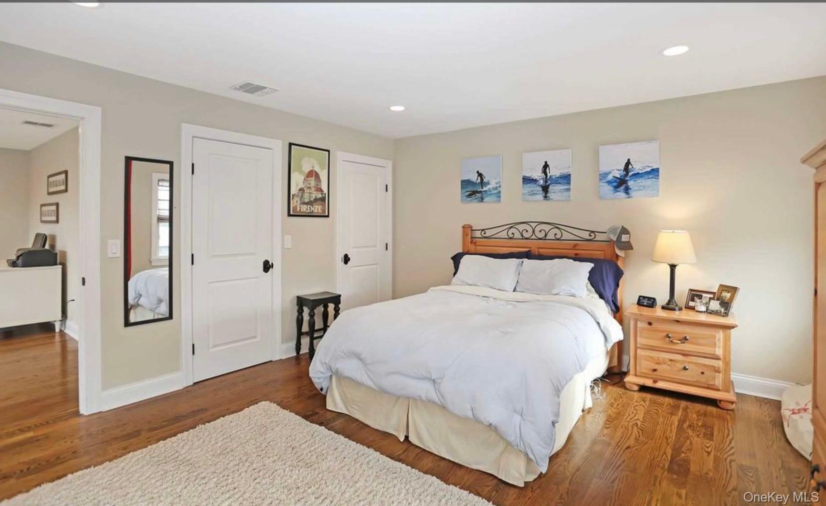 43 Shore Road Remsenburg, NY 11960 - Photo 20 of 28 a bedroom with a bed and a table