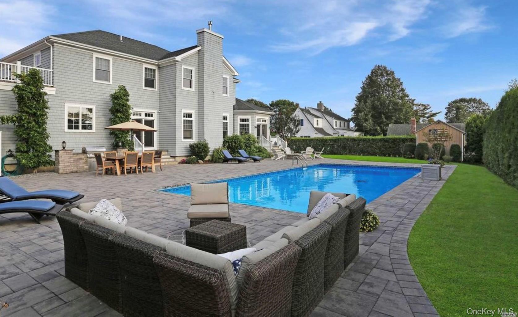 43 Shore Road Remsenburg, NY 11960 - Photo 21 of 28 a view of a house with swimming pool and sitting area
