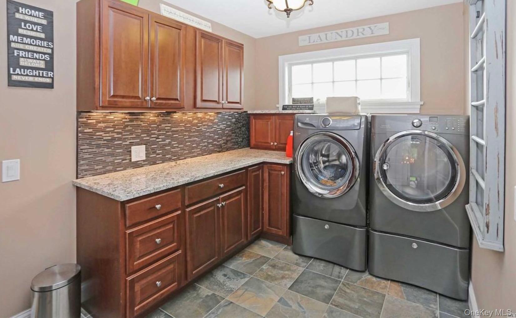 43 Shore Road Remsenburg, NY 11960 - Photo 22 of 28 a utility room with sink dryer and washer