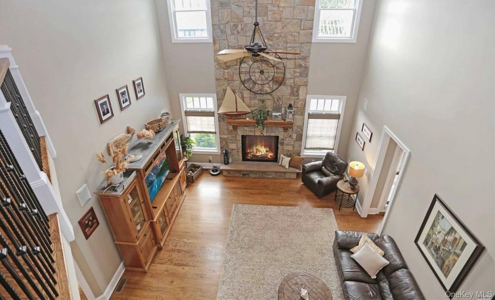 43 Shore Road Remsenburg, NY 11960 - Photo 24 of 28 a view of a livingroom with furniture and a fireplace