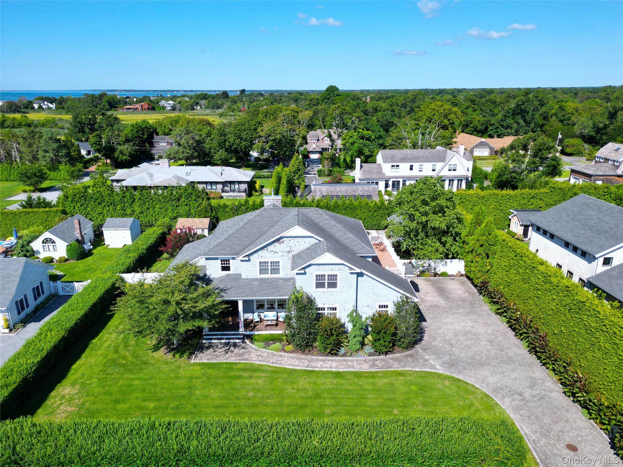 43 Shore Road Remsenburg, NY 11960 - Photo 3 of 28 an aerial view of multiple houses with yard