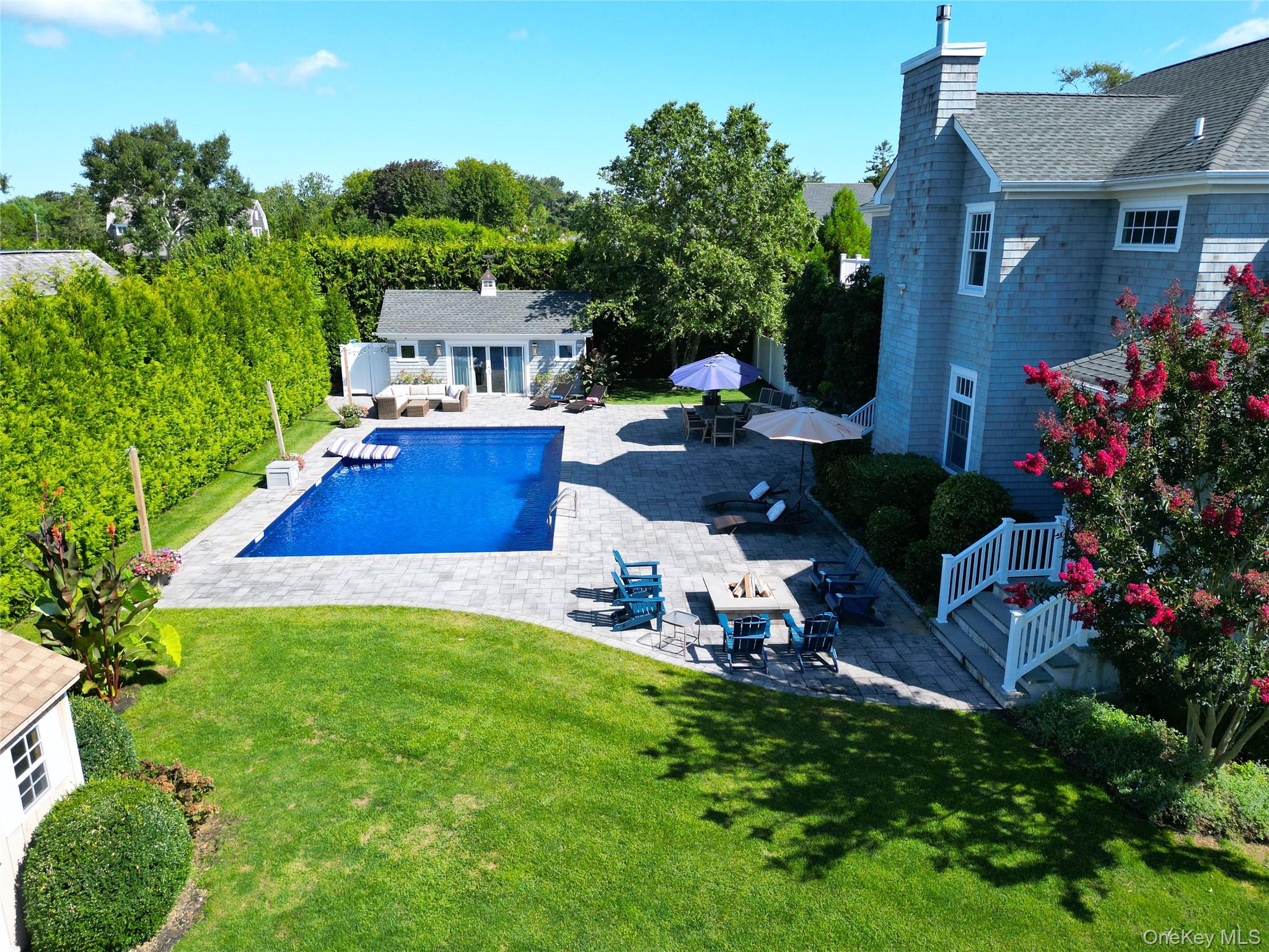 43 Shore Road Remsenburg, NY 11960 - Photo 7 of 28 a front view of house with yard and outdoor seating