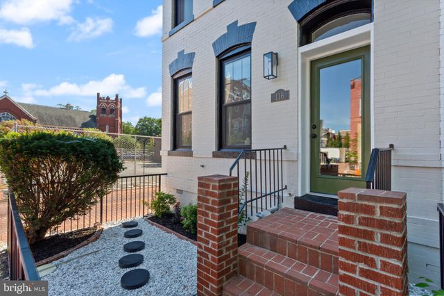 a balcony view with a seating space