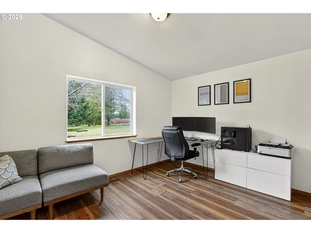a work room with furniture and a window
