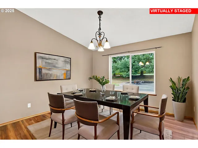 a dining room with furniture a window and a chandelier