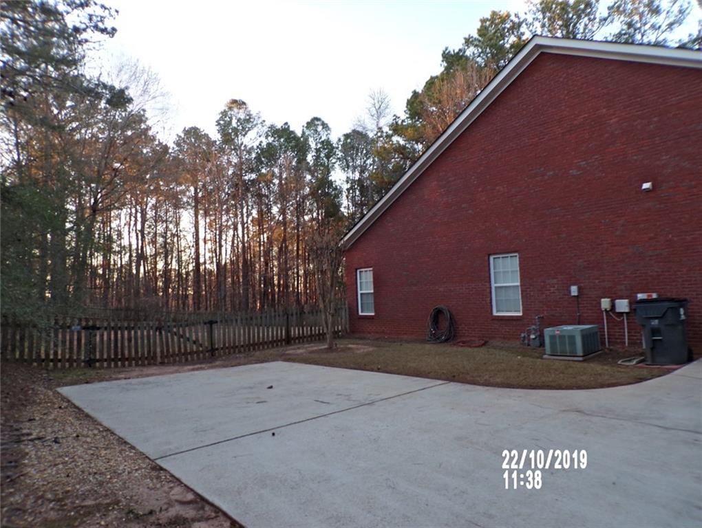 1035 Upchurch Road McDonough, GA 30252 - Photo 41 of 48 a front view of a house with a yard