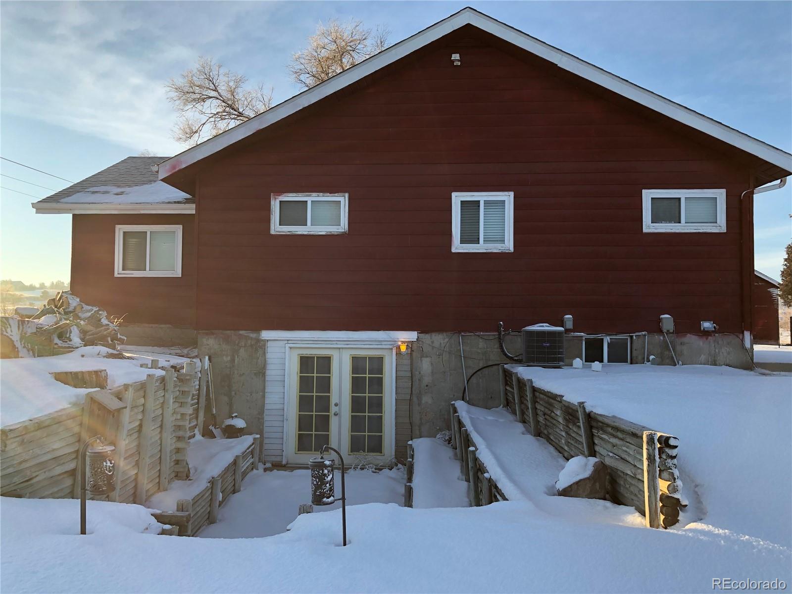 1671 North State Highway 83, Unit B Franktown, CO 80116 - Photo 1 of 21 a view of a house with pool and dining table