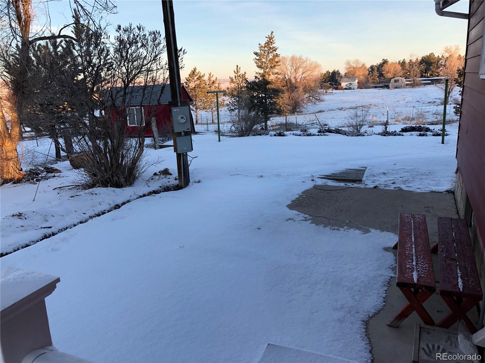1671 North State Highway 83, Unit B Franktown, CO 80116 - Photo 18 of 21 a view of a road with a building in the background