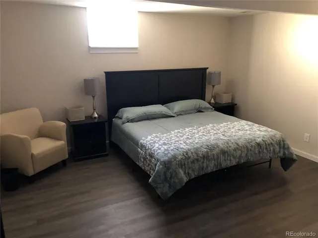 a bedroom with a bed and a couch