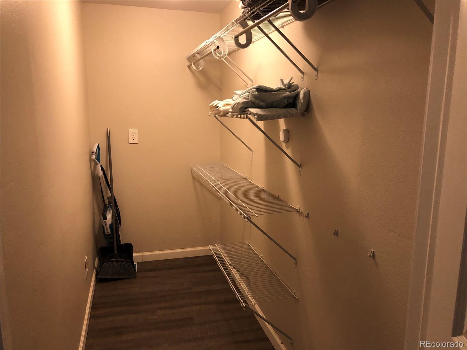 1671 North State Highway 83, Unit B Franktown, CO 80116 - Photo 3 of 21 a view of entryway with wooden floor