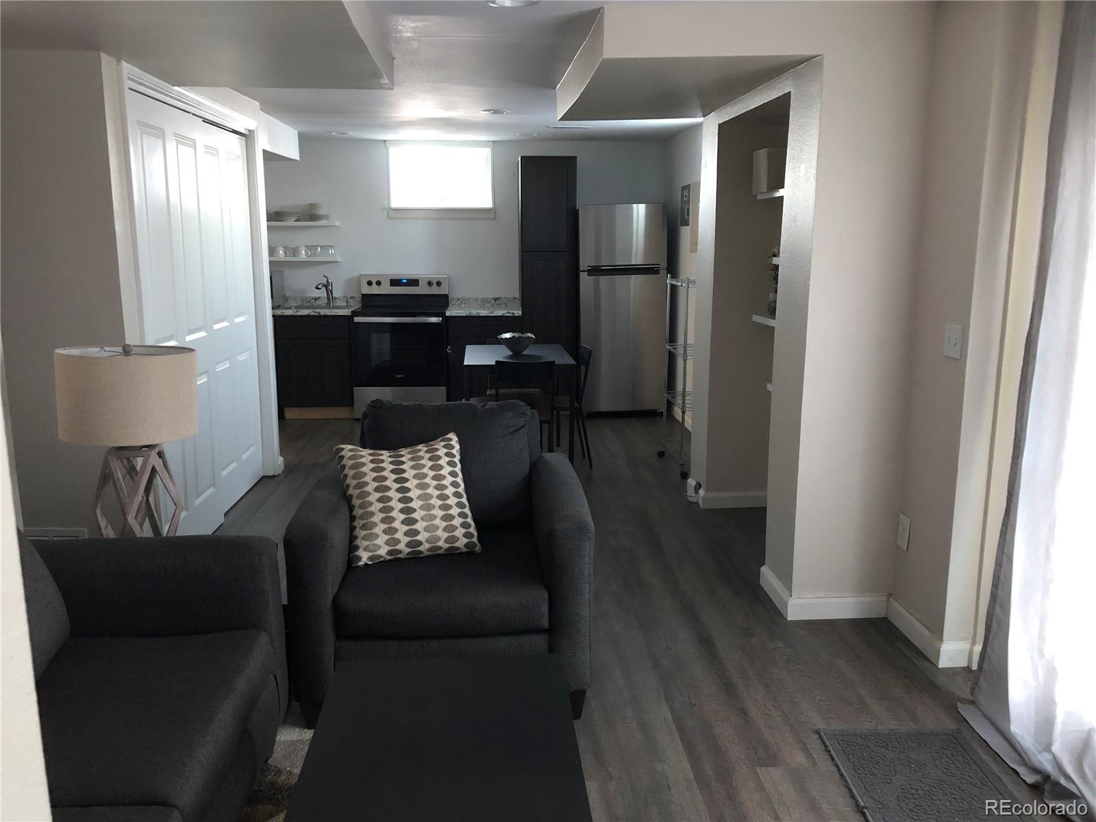 1671 North State Highway 83, Unit B Franktown, CO 80116 - Photo 8 of 21 a living room with furniture and a window
