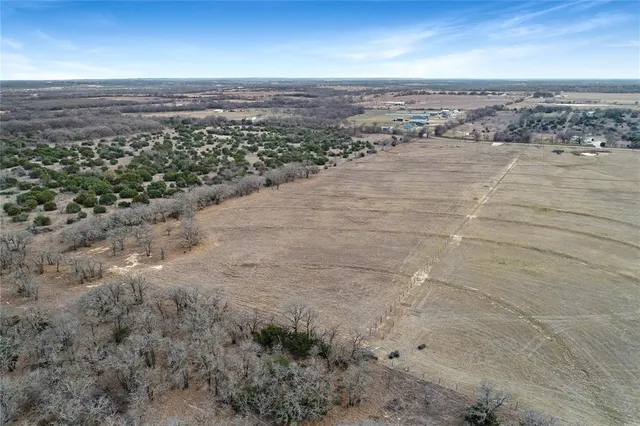 an aerial view of beach and city