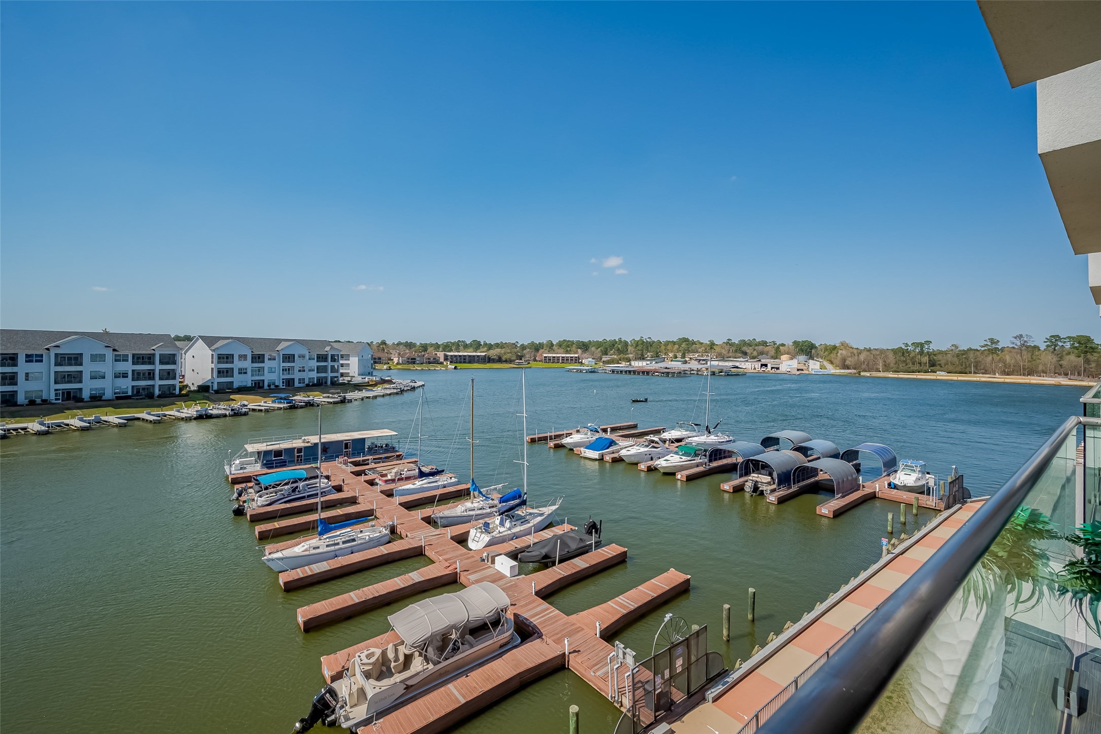 199 Waterpoint Court, Unit 302 Conroe, TX 77356 - Photo 17 of 20 Step outside and onto the water! These exclusive private docks offer the perfect spot to launch your boat, jet ski, or kayak for endless adventures on Lake Conroe.