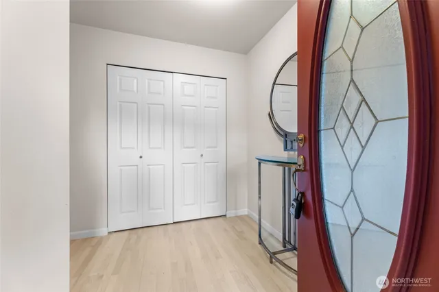 a view of an entryway with wooden floor