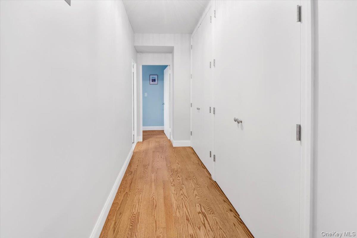 3777 Independence Avenue, Unit 16F Bronx, NY 10463 - Photo 13 of 27 a view of a hallway with wooden floor