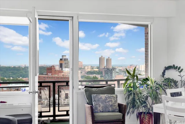 a view of a chair and table in the balcony