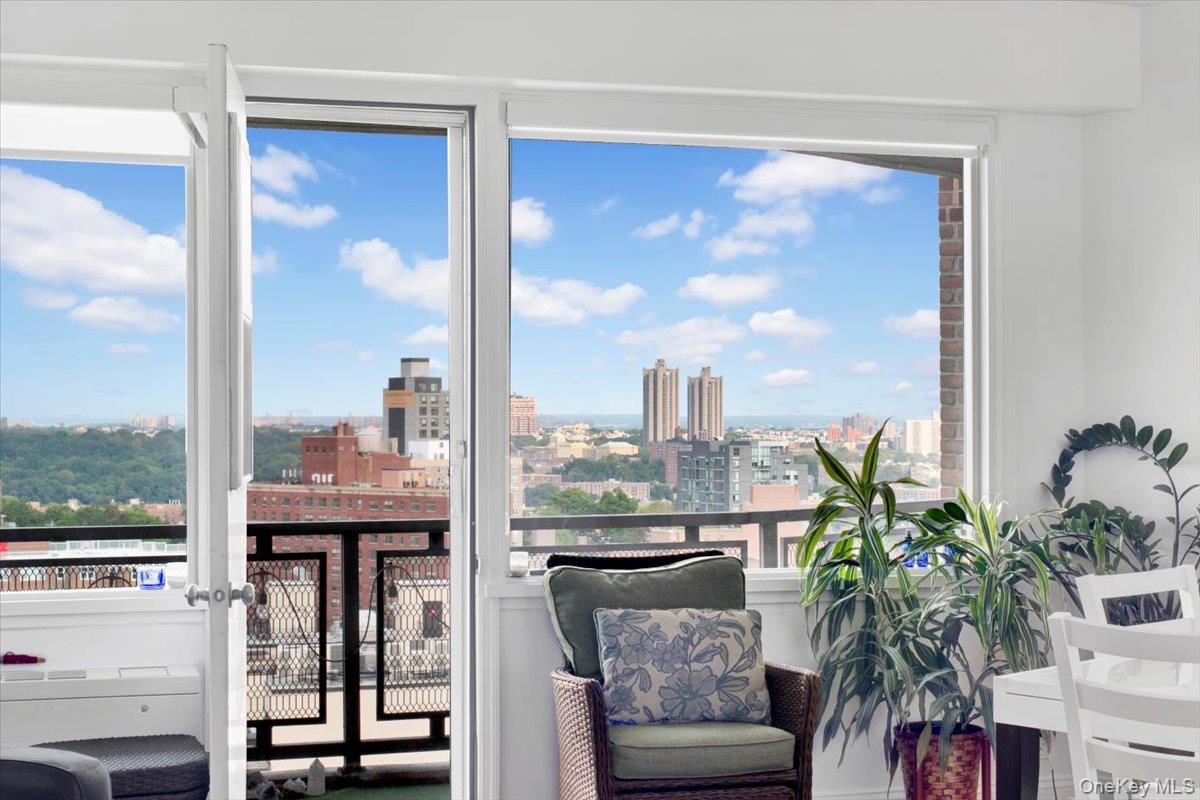 3777 Independence Avenue, Unit 16F Bronx, NY 10463 - Photo 23 of 27 a living room with furniture kitchen view and a potted plant