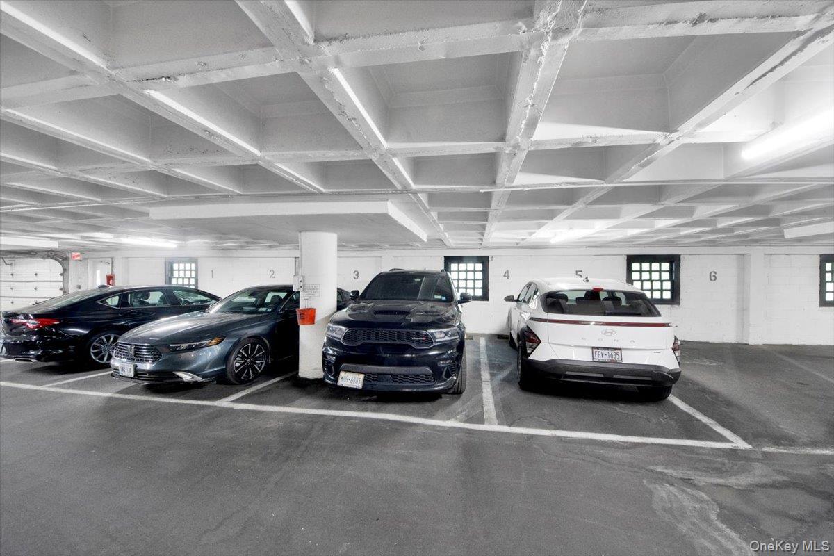 3777 Independence Avenue, Unit 16F Bronx, NY 10463 - Photo 25 of 27 a view of parking garage with cars