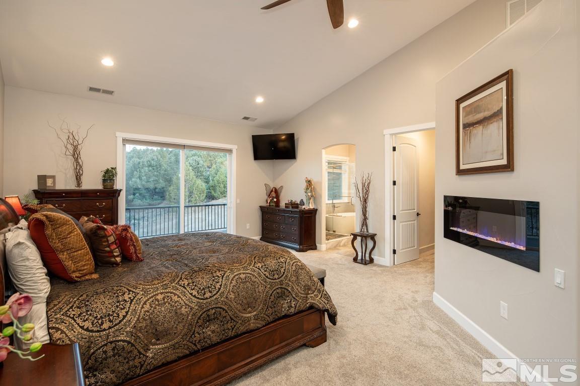 4610 Tybo Road Reno, NV 89521 - Photo 12 of 40 a bedroom with a bed and wooden floor