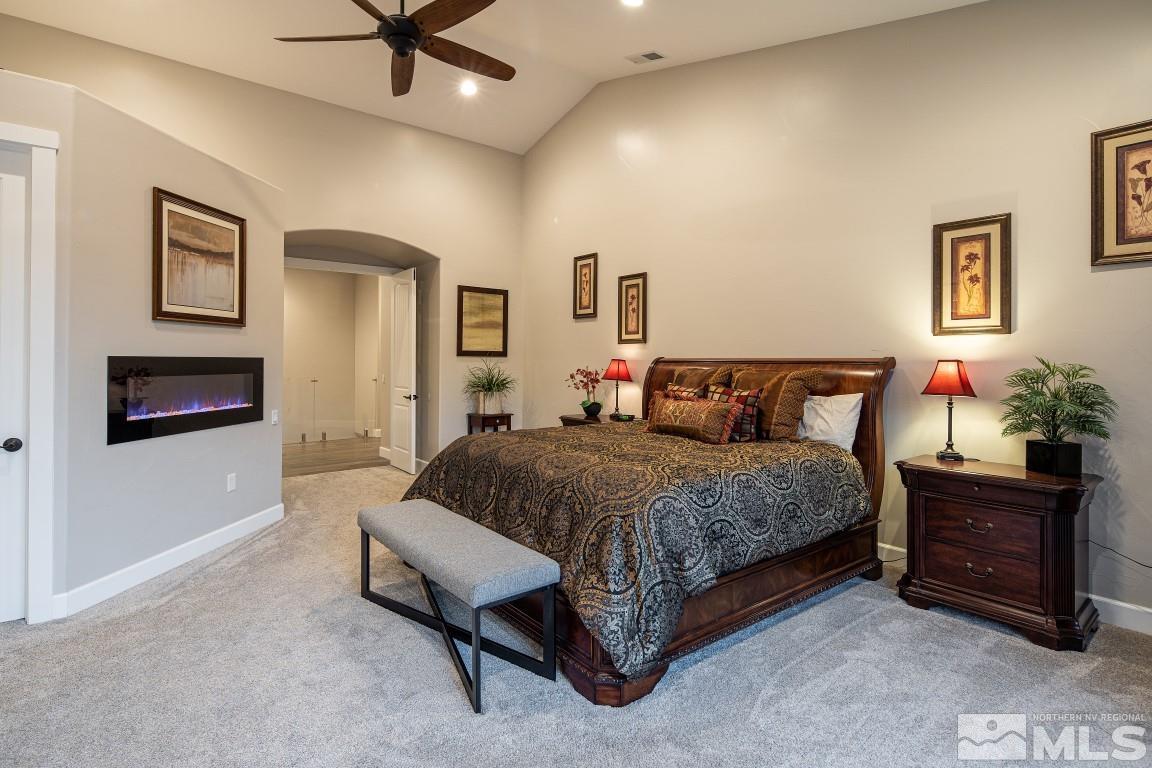 4610 Tybo Road Reno, NV 89521 - Photo 14 of 40 a bedroom with a bed and a potted plant