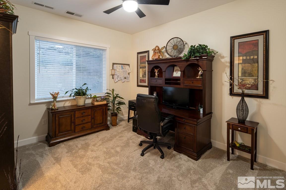4610 Tybo Road Reno, NV 89521 - Photo 20 of 40 a view of a workspace with furniture and a window