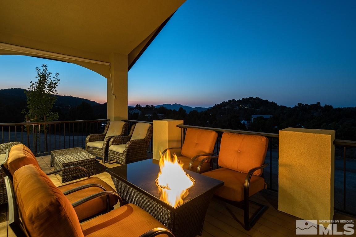 4610 Tybo Road Reno, NV 89521 - Photo 2 of 40 a view of a balcony with chairs and a potted plant