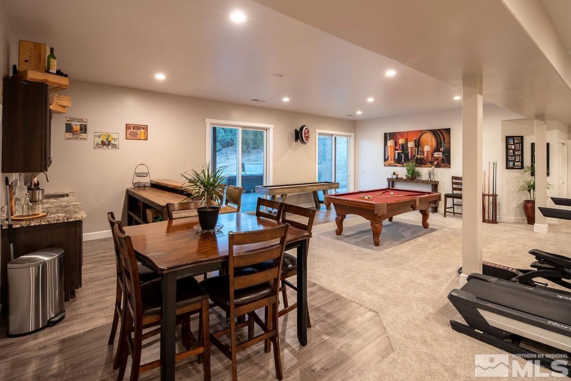 4610 Tybo Road Reno, NV 89521 - Photo 27 of 40 a living room with furniture a flat screen tv and kitchen view