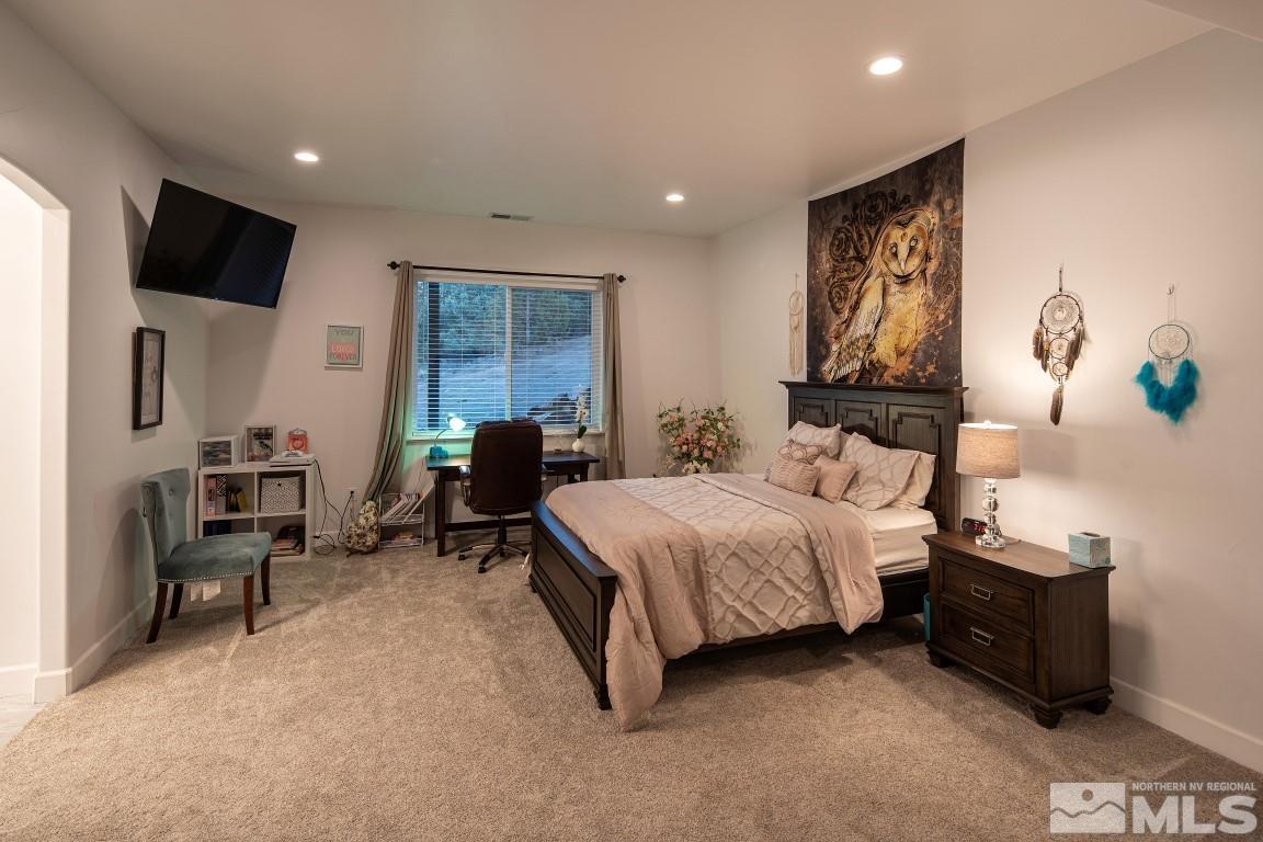 4610 Tybo Road Reno, NV 89521 - Photo 29 of 40 a bedroom with a bed and a television