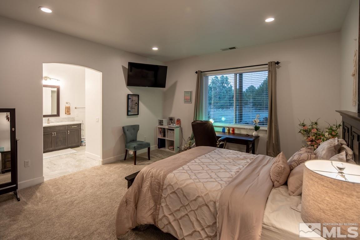 4610 Tybo Road Reno, NV 89521 - Photo 30 of 40 a bed room with a bed and furniture